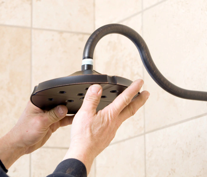 Bathroom showerhead replacement, installation, and plumbing service.