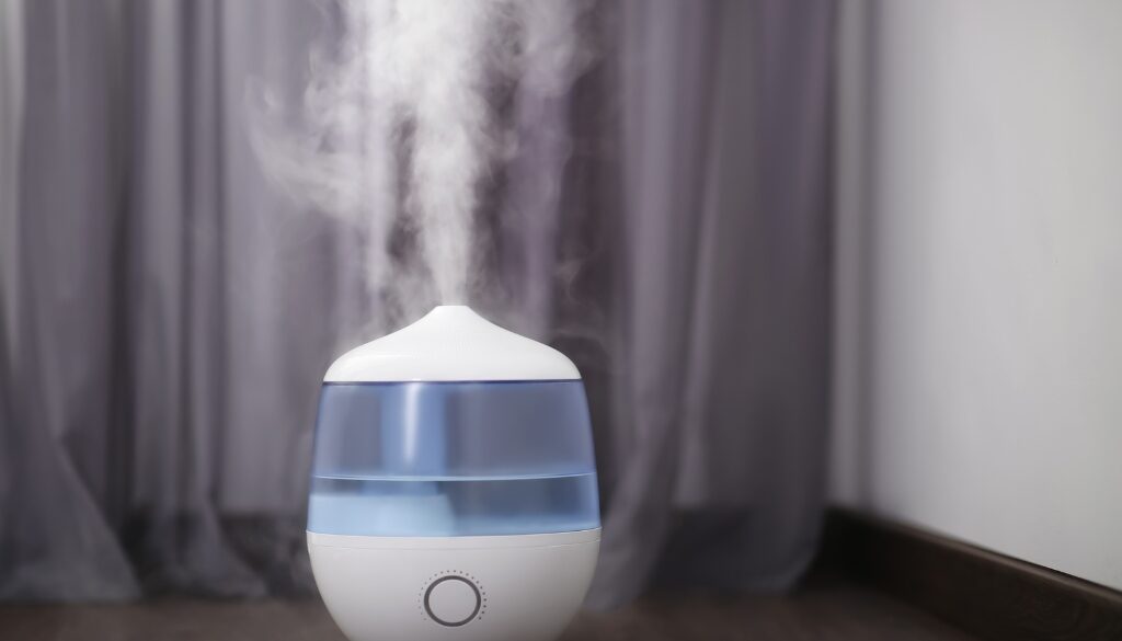 Close-up of a home humidifier releasing mist, helping to improve indoor air quality and maintain comfortable humidity levels during winter.