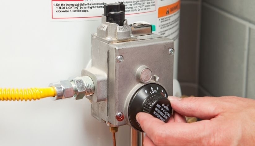 niebuhr-plumbing-heating-air-conditioning-flush-water-heater-hand-turning-heat