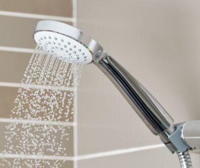 Silver showerhead produces cold water after shower runs out of hot water.